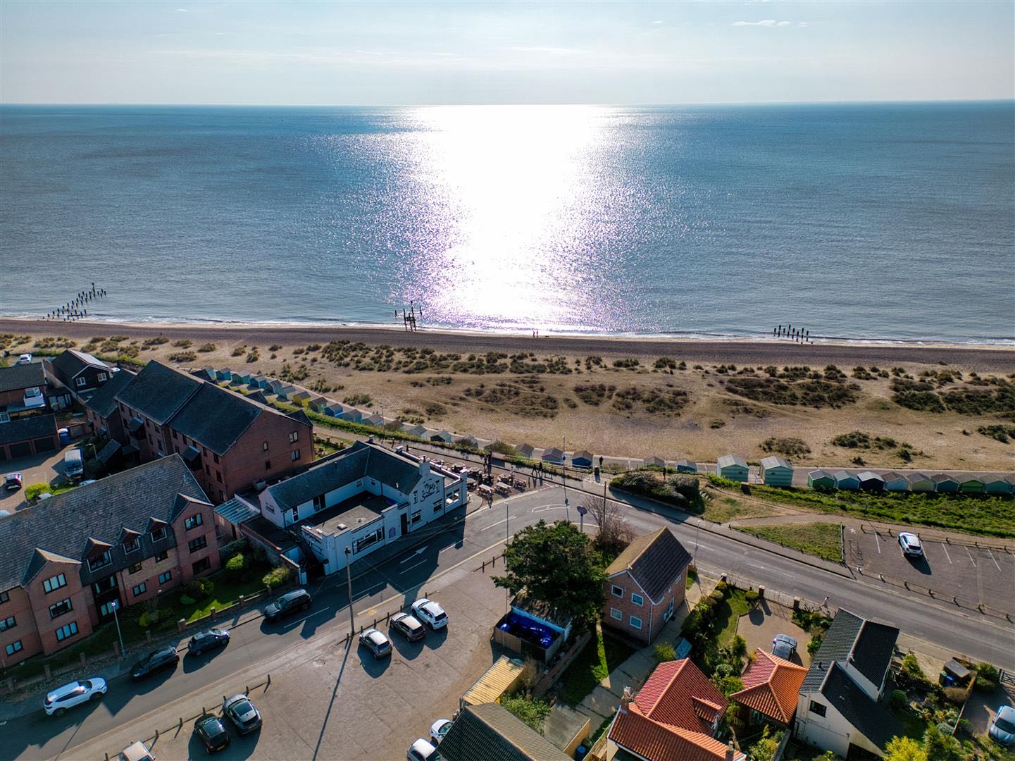 Aerial view of Pakefield seafront in Suffolk, with the beach, coastal road and residential properties